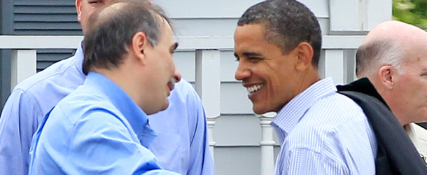 President Barack Obama talks with senior adviser David Axelrod in 2010. /AP Photo/Charles Dharapak