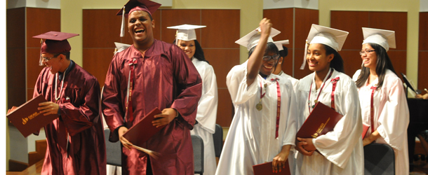 Chicago Virtual School students John Colon, Romell Brown, Brenice Brown, Joy Augustin, Keren Gomez, Amelia Henry, Shanice Mabry and Fano Vonjimalala celebrate at graduation. // Photo courtesy of Craig Butz.