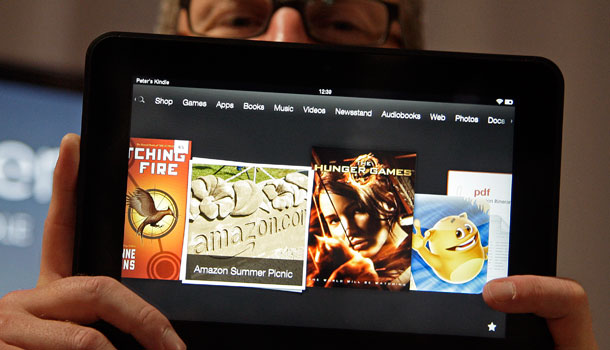 Amazon Kindle vice president Peter Larsen holds the Kindle Fire HD at the introduction of the new Kindle devices in Santa Monica, Calif., Thursday, Sept. 6, 2012. /AP Photo/Reed Saxon