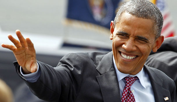 President Barack Obama waves to supporters as he arrives at the Charlotte/Douglas International Airport for the Democratic National Convention in Charlotte, N.C., Wednesday, Sept. 5, 2012. /AP Photo/Chuck Burton