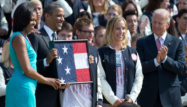 From left, first lady Michelle Obama, President Barack Obama, U.S. Paralympic flag bearer and Navy Veteran Brad Snyder, U.S. Olympic flag bearer Mariel Zagunis, and Vice President Joe Biden, take part in a ceremony on the South Lawn of the White House in Washington, Friday, Sept. 14, 2012, to welcome the 2012 U.S. Olympic and Paralympic teams. /AP Photo/Carolyn Kaster