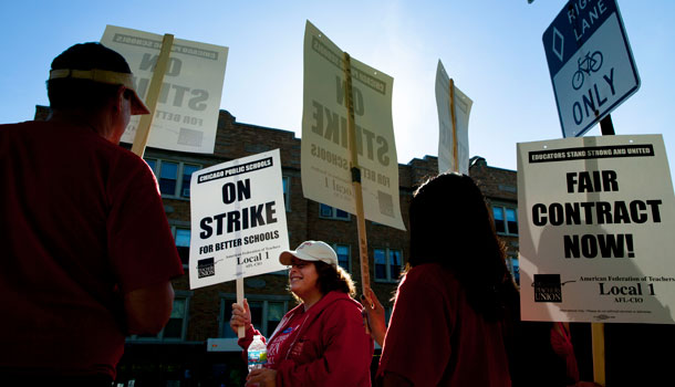 Public school teachers picket on the first day of a strike by the Chicago Teachers Union, Monday, Sept. 10, 2012. /AP Photo/Sitthixay Ditthavong