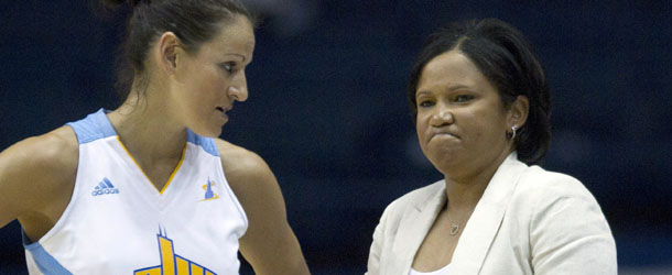 Chicago Sky head coach Pokey Chatman (r) talks to player Ticha Penicheiro during a July 2012 WNBA game. /AP Photo/Charles Rex Arbogast