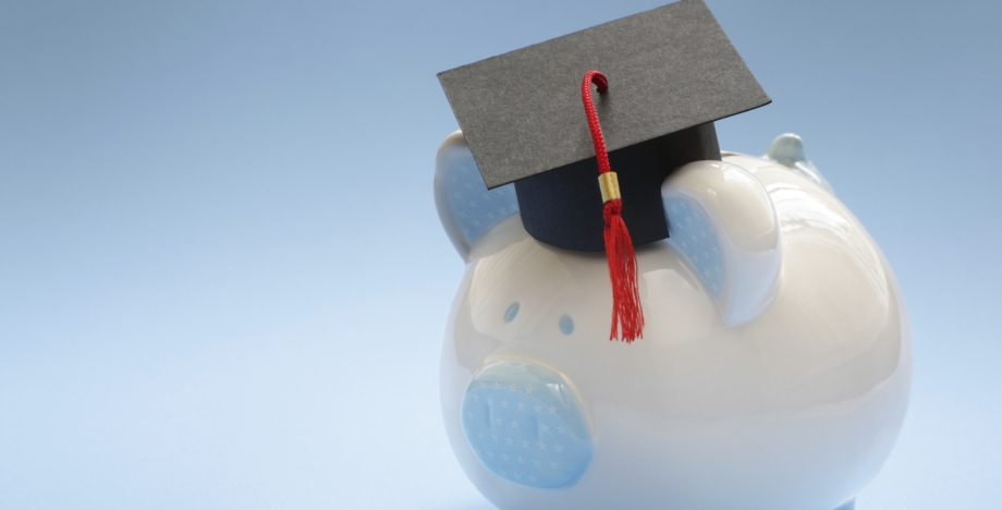 Blue piggy bank with a graduation cap